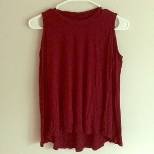 A long sleeve shirt with a shoulder cut out